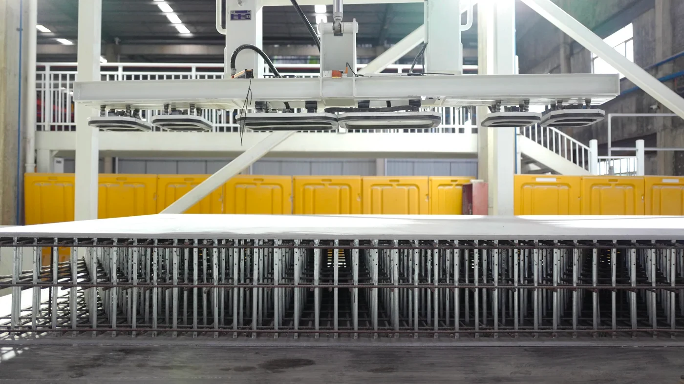 Vacuum lifter engaging the assembly on the mold table